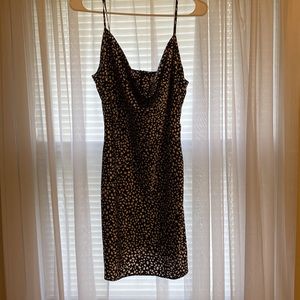 Short black and white silk cowl neck slip dress.